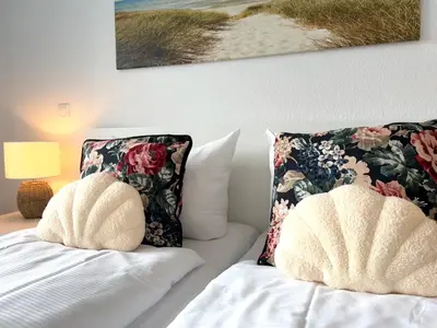 Ein Bett oder Betten in einem Zimmer der Unterkunft Nordseebrandung A2 1