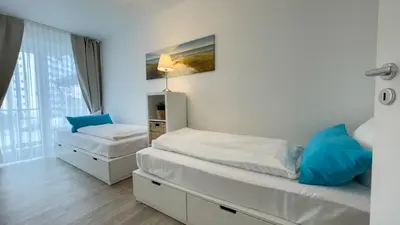 Ein Bett oder Betten in einem Zimmer der Unterkunft Nordseebrandung A2 1