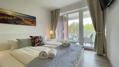 Ein Bett oder Betten in einem Zimmer der Unterkunft Nordseebrandung A2 3