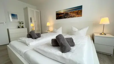 Ein Bett oder Betten in einem Zimmer der Unterkunft Nordseebrandung C1 1