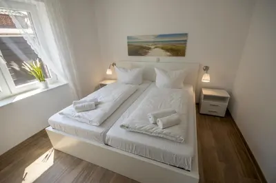 Ein Bett oder Betten in einem Zimmer der Unterkunft Duhner Strand Whg 1
