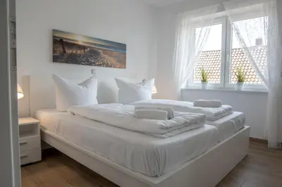 Ein Bett oder Betten in einem Zimmer der Unterkunft Duhner Strand Whg 4