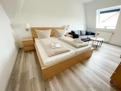 Ein Bett oder Betten in einem Zimmer der Unterkunft Residenz Grantz Sahlenburg Wohnung 3