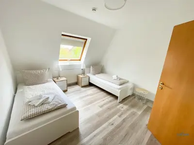 Ein Bett oder Betten in einem Zimmer der Unterkunft Residenz Grantz Sahlenburg Wohnung 3