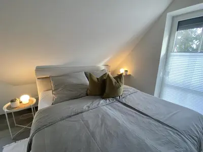 Ein Bett oder Betten in einem Zimmer der Unterkunft Meerglück CUX