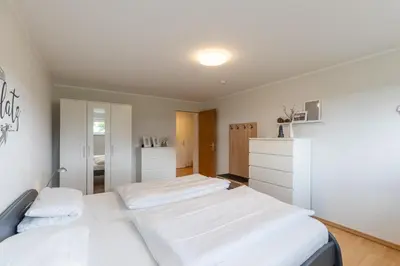 Ein Bett oder Betten in einem Zimmer der Unterkunft Haus Vogelsand, App 309