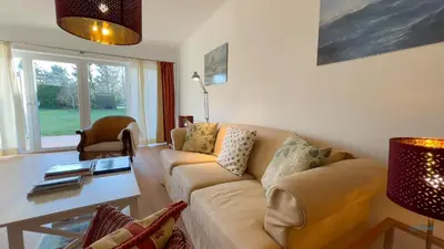 Ein Sitzbereich in der Unterkunft Ferienhaus James