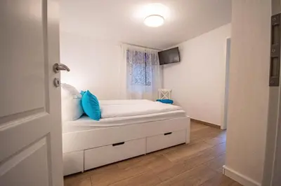 Ein Bett oder Betten in einem Zimmer der Unterkunft Kapitänshaus FeWo 2