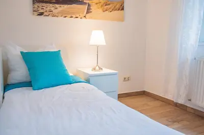 Ein Bett oder Betten in einem Zimmer der Unterkunft Kapitänshaus FeWo 2