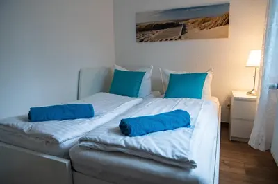 Ein Bett oder Betten in einem Zimmer der Unterkunft Kapitänshaus FeWo 2