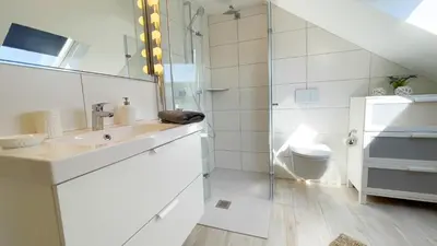Ein Badezimmer in der Unterkunft Kapitänshaus FeWo 4