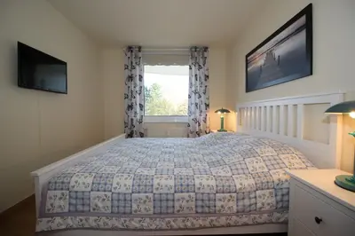 Ein Bett oder Betten in einem Zimmer der Unterkunft Kurpark-Residenz 108
