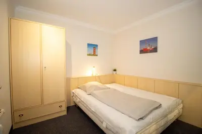 Ein Bett oder Betten in einem Zimmer der Unterkunft Kurpark-Residenz 121