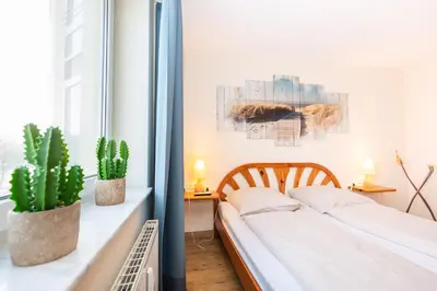 Ein Bett oder Betten in einem Zimmer der Unterkunft Kurpark-Residenz 113