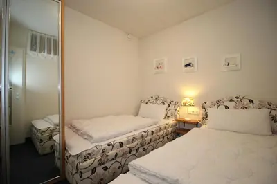 Ein Bett oder Betten in einem Zimmer der Unterkunft Kurpark-Residenz 132
