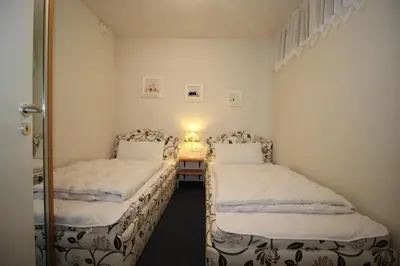 Ein Bett oder Betten in einem Zimmer der Unterkunft Kurpark-Residenz 132