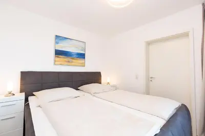 Ein Bett oder Betten in einem Zimmer der Unterkunft Kurpark-Residenz 241