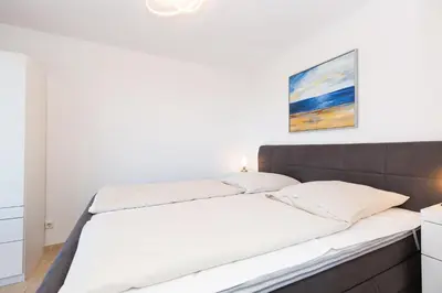 Ein Bett oder Betten in einem Zimmer der Unterkunft Kurpark-Residenz 241