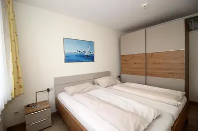 Ein Bett oder Betten in einem Zimmer der Unterkunft Kurpark-Residenz 208