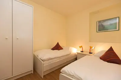 Ein Bett oder Betten in einem Zimmer der Unterkunft Kurpark-Residenz 135