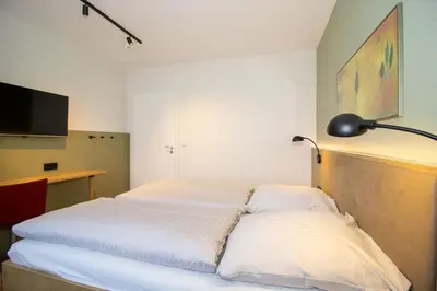 Ein Bett oder Betten in einem Zimmer der Unterkunft Kurpark-Residenz 117