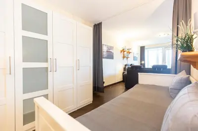 Ein Bett oder Betten in einem Zimmer der Unterkunft Kurpark-Residenz 144