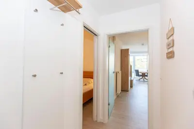 Ein Bett oder Betten in einem Zimmer der Unterkunft Kurpark-Residenz 143
