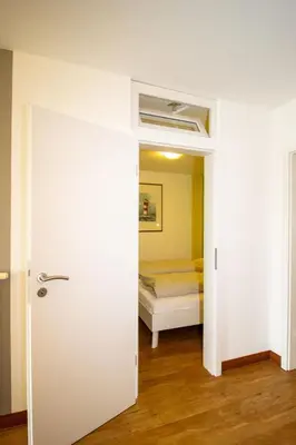 Ein Bett oder Betten in einem Zimmer der Unterkunft Kurpark-Residenz 141