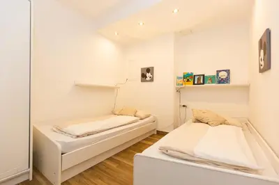 Ein Bett oder Betten in einem Zimmer der Unterkunft Kurpark-Residenz 235