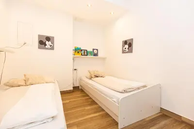 Ein Bett oder Betten in einem Zimmer der Unterkunft Kurpark-Residenz 235