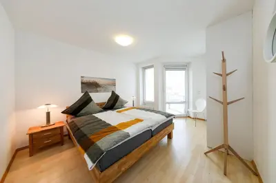 Ein Bett oder Betten in einem Zimmer der Unterkunft Kurpark-Residenz 224