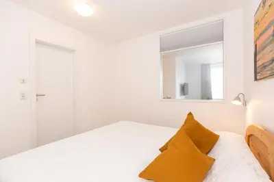 Ein Bett oder Betten in einem Zimmer der Unterkunft Kurpark-Residenz 139