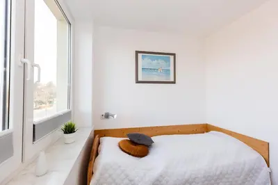 Ein Bett oder Betten in einem Zimmer der Unterkunft Kurpark-Residenz 139