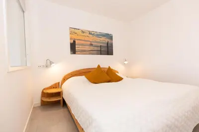 Ein Bett oder Betten in einem Zimmer der Unterkunft Kurpark-Residenz 139