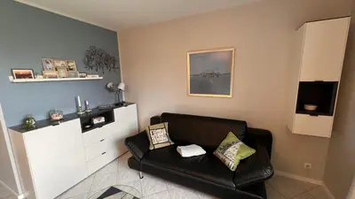 Ein Sitzbereich in der Unterkunft Ferienwohnung am Kormoranweg