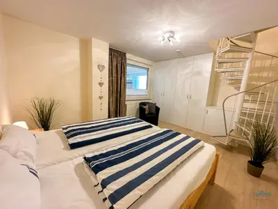 Ein Bett oder Betten in einem Zimmer der Unterkunft Haus Nautic Döse Wohnung 214