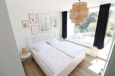 Ein Bett oder Betten in einem Zimmer der Unterkunft Meerhaus EG