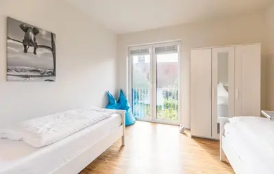 Ein Bett oder Betten in einem Zimmer der Unterkunft Kirchenstr 22 Bi de Kark