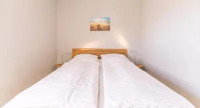 Ein Bett oder Betten in einem Zimmer der Unterkunft 