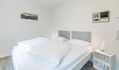 Ein Bett oder Betten in einem Zimmer der Unterkunft Strandtraum Strandtraum