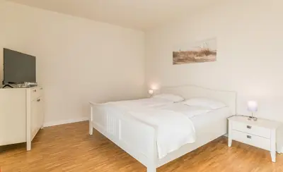 Ein Bett oder Betten in einem Zimmer der Unterkunft Kirchenstr 22 Nordlichter