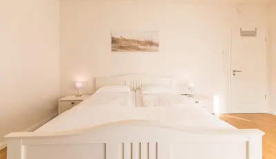 Ein Bett oder Betten in einem Zimmer der Unterkunft Kirchenstr 22 Nordlichter