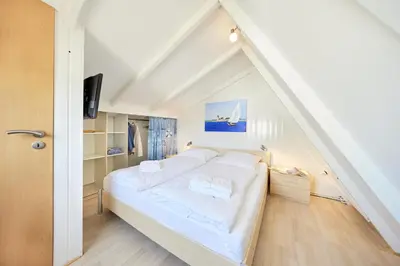Ein Bett oder Betten in einem Zimmer der Unterkunft Am Ringwall 91 - Seelöwe B