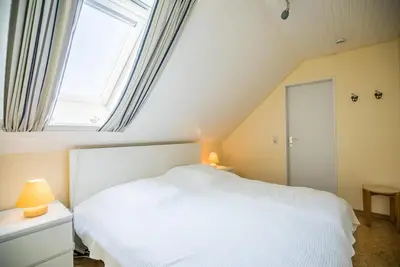 Ein Bett oder Betten in einem Zimmer der Unterkunft 