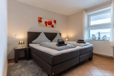 Ein Bett oder Betten in einem Zimmer der Unterkunft Am Ankerplatz, Whg 3 3