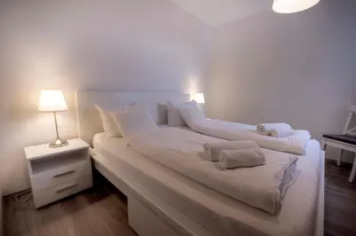 Ein Bett oder Betten in einem Zimmer der Unterkunft Frische Brise FeWo 10 01