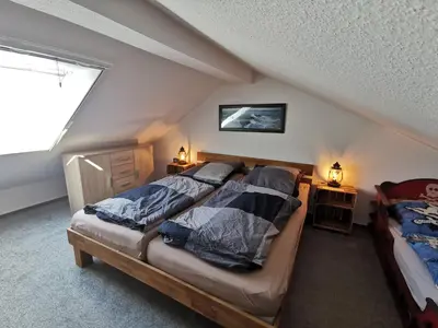 Ein Bett oder Betten in einem Zimmer der Unterkunft Fewo Dorumer Piratennest