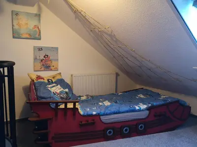 Ein Bett oder Betten in einem Zimmer der Unterkunft Fewo Dorumer Piratennest