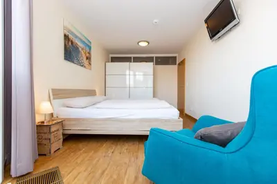 Ein Bett oder Betten in einem Zimmer der Unterkunft Kurpark-Residenz 118