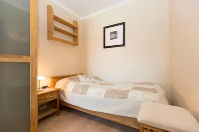 Ein Bett oder Betten in einem Zimmer der Unterkunft Strandhochhaus 5